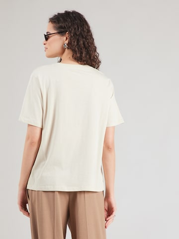 Tricou de la Mavi pe bej