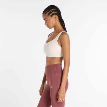 Bustino Reggiseno sportivo 'Harmon' di new balance in bianco