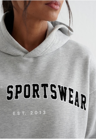 Sweat de sport Aim'n en gris