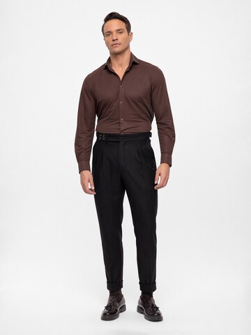 Antioch Tapered Pleat-front trousers in Black