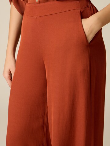 oltre Baggy Trousers in Orange
