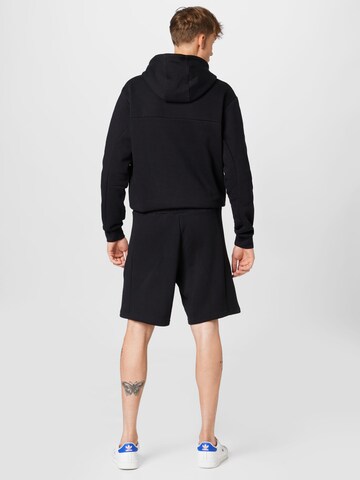 Regular Pantaloni sport 'Stadium Fleece Recycled Badge Of' de la ADIDAS SPORTSWEAR pe negru