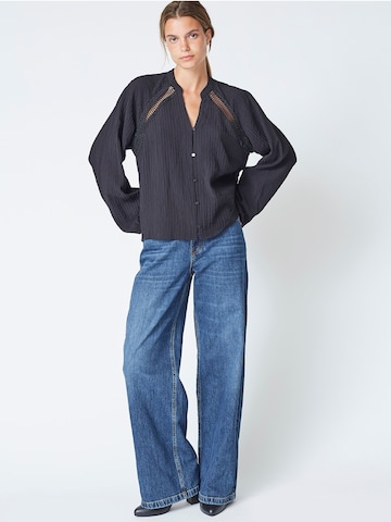 Chemisier 'Shina' co'couture en noir