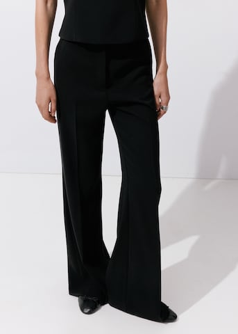 MANGO Boot cut Trousers with creases 'IGUANA' in Black: front