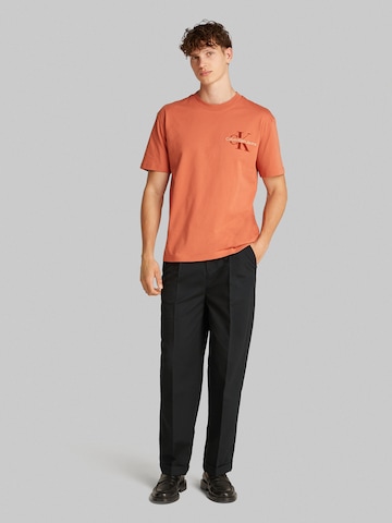 Loosefit Pantalon à plis Calvin Klein Jeans en noir