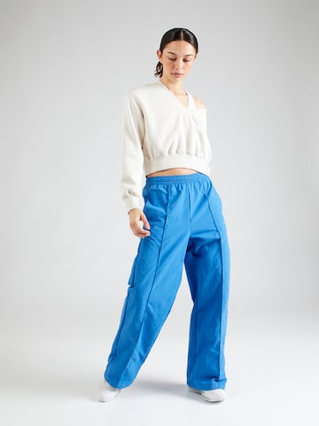 Nike Sportswear Wide leg Pantalon in Blauw