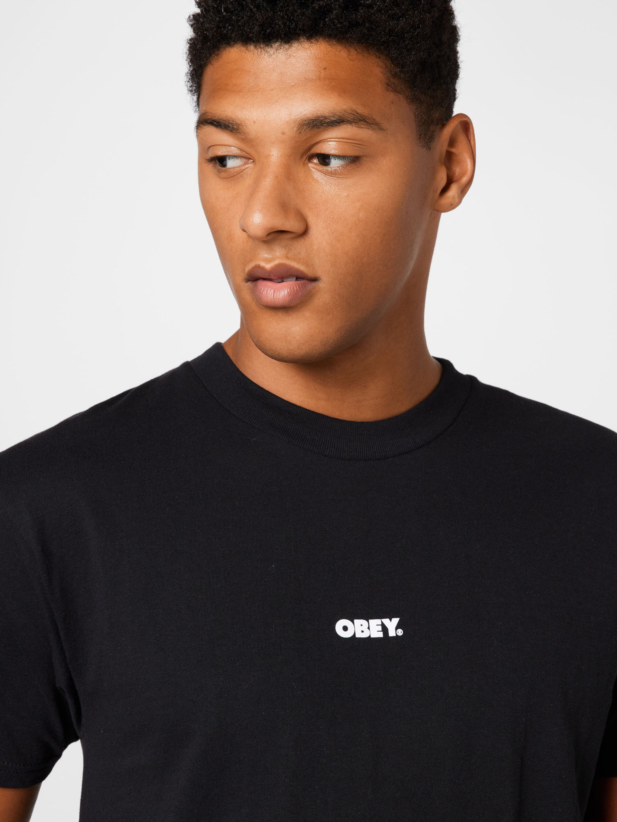 Homme T-Shirt Obey en Noir 
