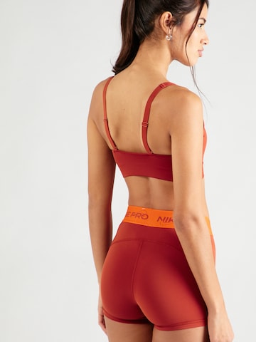 NIKE - Soutien Bustier Soutien de desporto 'INDY' em laranja