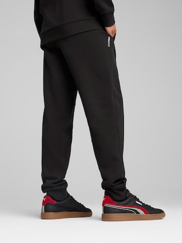 Tapered Pantaloni 'PUMATECH' di PUMA in nero