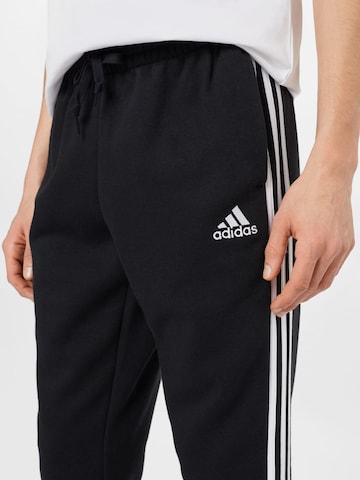 ADIDAS SPORTSWEAR Zúžený Sportovní kalhoty 'Essentials Fleece Tapered Cuff 3-Stripes' – černá