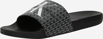 Calvin Klein Jeans Strand-/badsko i svart: framsida
