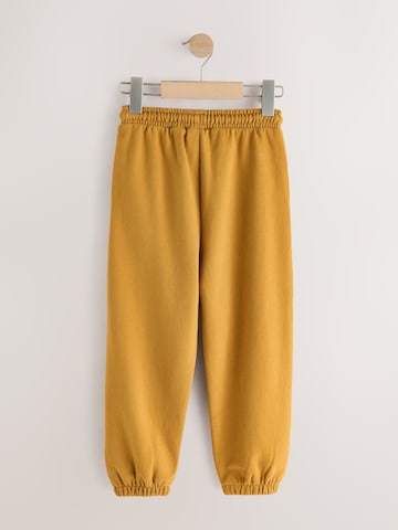 Next Tapered Housut värissä keltainen