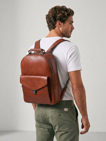 The Bridge Backpack in Brown: front
