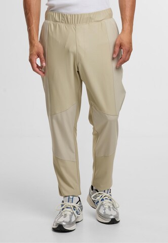 Sergio Tacchini Tapered Urheiluhousut 'Pelle' värissä harmaa: etupuoli