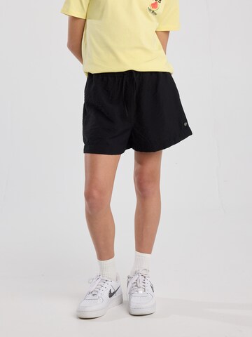 America Today Loose fit Trousers in Black: front