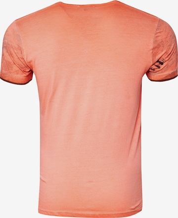 Rusty Neal T-Shirt mit lässigem Allover-Print in Orange