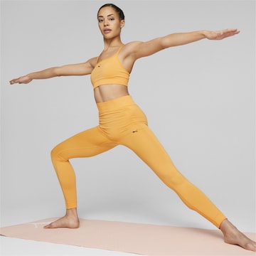 PUMA Skinny Παντελόνι φόρμας 'STUDIO FOUNDATIONS' σε πορτοκαλί
