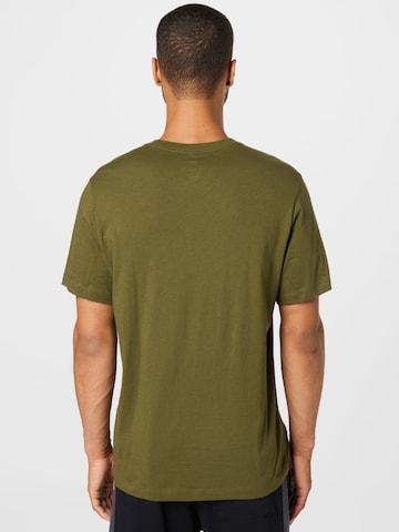 Regular fit Tricou 'Club' de la Nike Sportswear pe verde