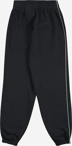 Effilé Pantalon Nike Sportswear en noir