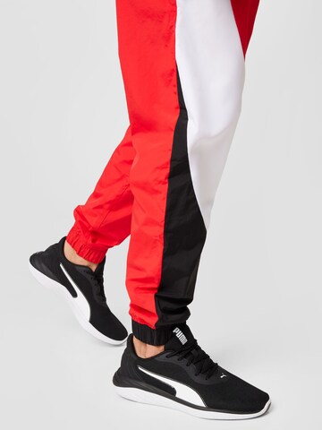 Effilé Pantalon de sport 'Clyde' PUMA en rouge