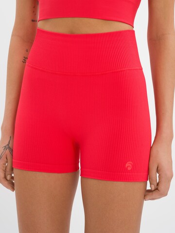 OCEANSAPART - Skinny Pantalón deportivo 'Maya' en rojo
