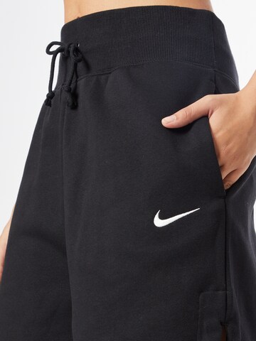 juoda Nike Sportswear Laisvas Kelnės 'Phoenix fleece'