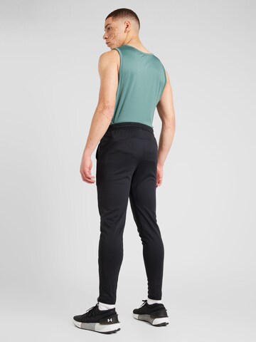 Tapered Pantaloni sportivi 'Tenacity' di new balance in nero