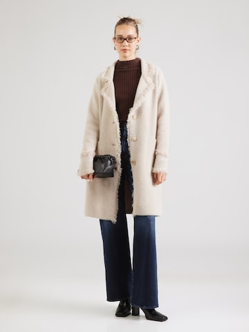 RINO & PELLE Stickad kappa 'Catena' i beige