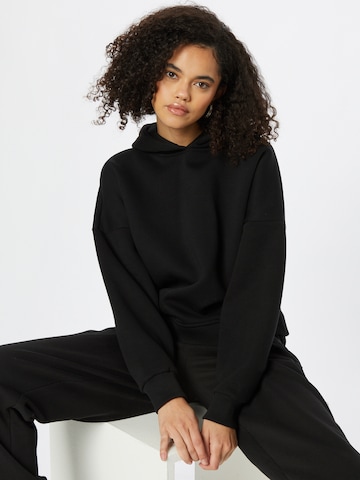 ABOUT YOU x INNA Sweatshirt 'Alessia' in Black: front