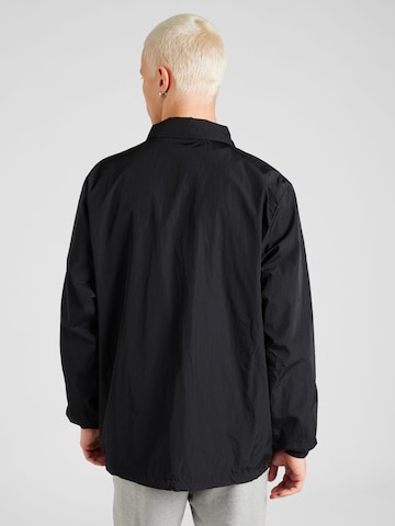 Veste mi-saison 'COACHES' Nike Sportswear en noir