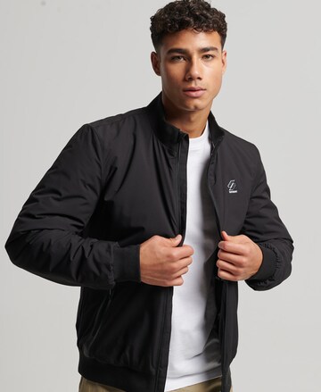 Veste mi-saison 'Harrington' Superdry en noir : devant