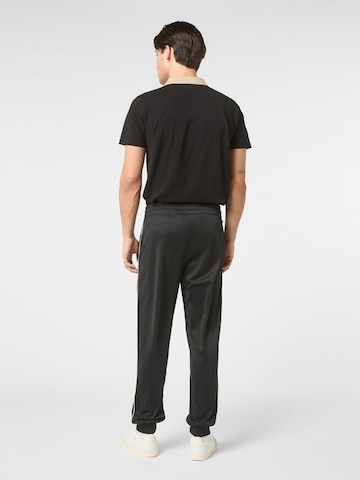 FILA Regular Housut 'SAGANO regular track pants' värissä musta