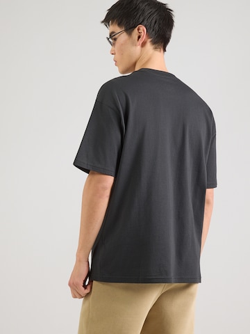 Nike Sportswear Μπλουζάκι 'FLY ABOVE' σε μαύρο