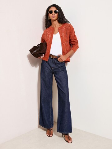 Friends Like These Neuletakki värissä oranssi