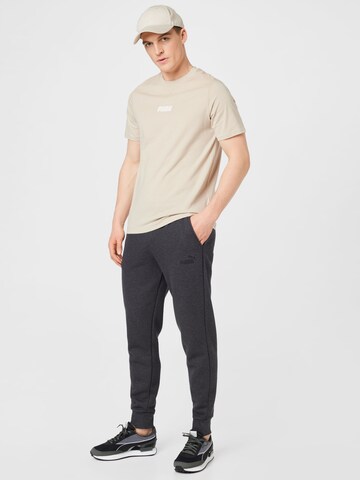 Effilé Pantalon de sport PUMA en gris