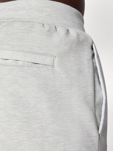 PUMA Конический (Tapered) Спортивные штаны 'Cloudspun' в Серый