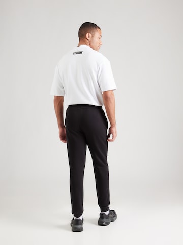 ELLESSE Zúžený strih Nohavice 'Cravo 2' - Čierna: zadná strana