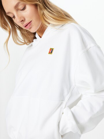 NIKE Sport sweatshirt i vit