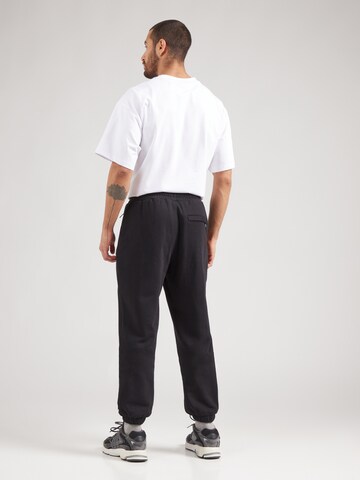 ELLESSE Zúžený Kalhoty 'PATRAS' – černá
