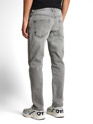 TOM TAILOR DENIM Tapered Jeans 'BRYDEN' in Grey