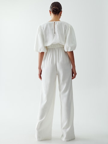 The Fated Jumpsuit 'PROUD' in White: back