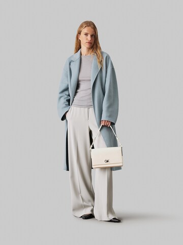 Calvin Klein Taška přes rameno – béžová