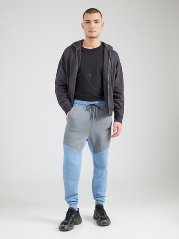 Nike Sportswear Tapered Broek 'TCH FLC' in Blauw