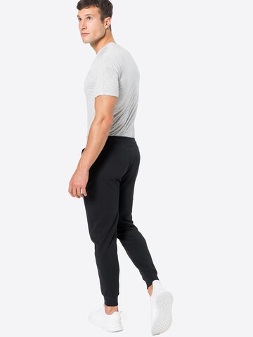 Superdry Zwężany krój Spodnie sportowe w kolorze czarny