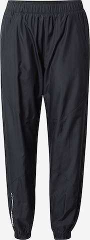 UNDER ARMOUR Tapered Sports trousers in Black: front