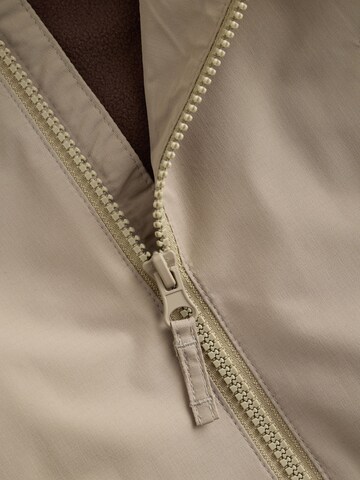 Next Tussenjas in Beige
