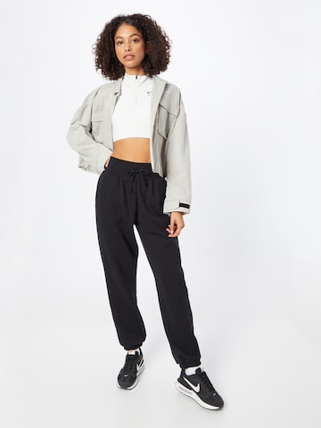 Tapered Pantaloni 'Phoenix Fleece' de la Nike Sportswear pe negru