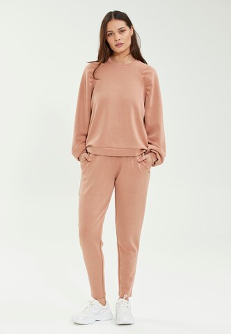 Athlecia Tapered Sportbroek in Beige