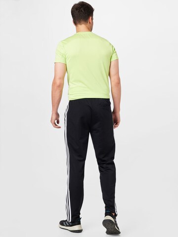 ADIDAS SPORTSWEAR Regular Urheiluhousut 'Tiro Essential' värissä musta