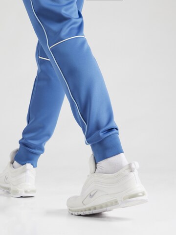 ELLESSE Tapered Trousers 'SAN MARINO' in Blue